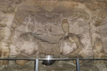 云冈石窟中最早的双窟石窟是哪一座？雕刻了什么？